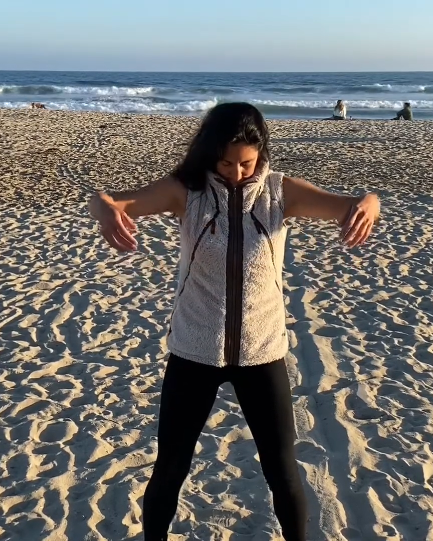 Qigong practice on the beach at sunrise