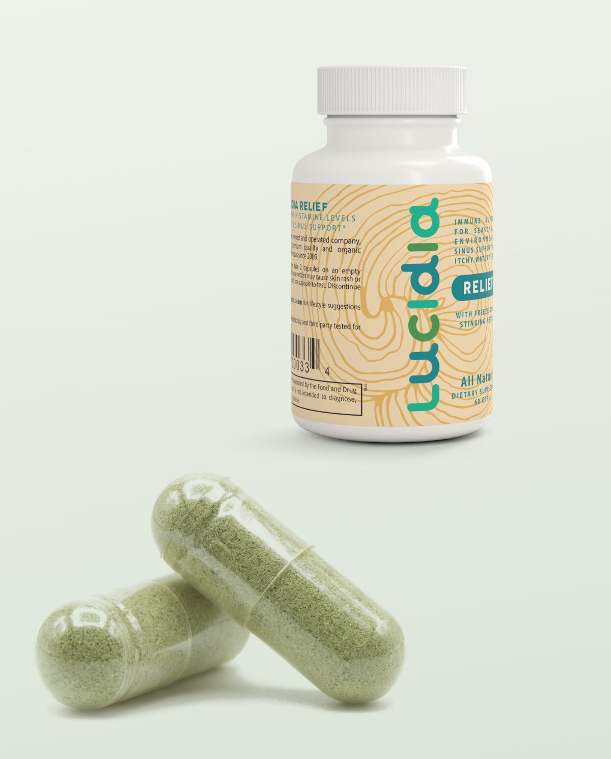 The Lucidia bottle with two capsules of sage-green nettle powder in front